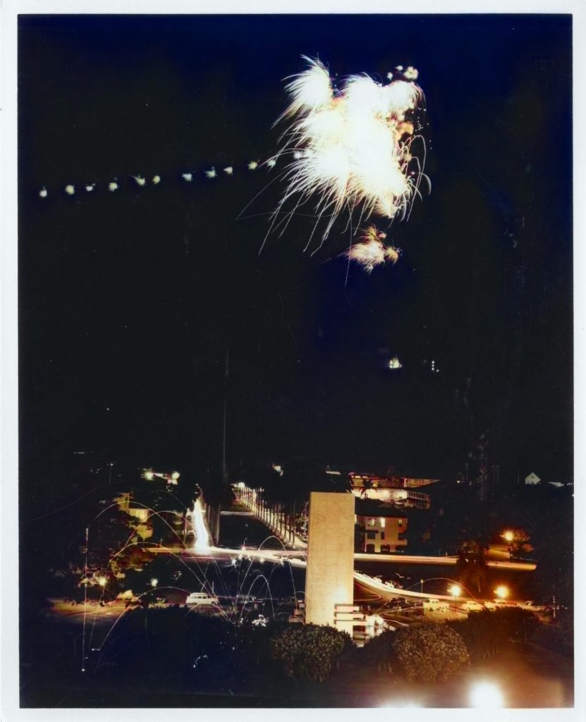 A photograph of fireworks taken from Sosa Hill on July 4th, 1954-1960. The Goethals Monument i below the fireworks.