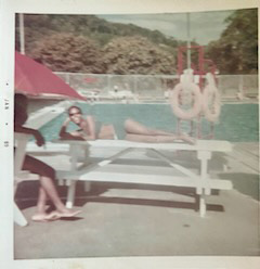 A woman relaxing near a swimming pool in Gamboa.